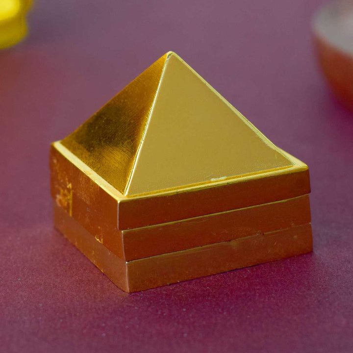 Brass Vastu Pyramid (Vastu Devta Yantra) featuring 45 deity zones, designed to balance energy flow, correct Vastu dosh, and bring prosperity and peace to any space.
India’s Largest Pooja Accessories Brand - www.satvikworld.com