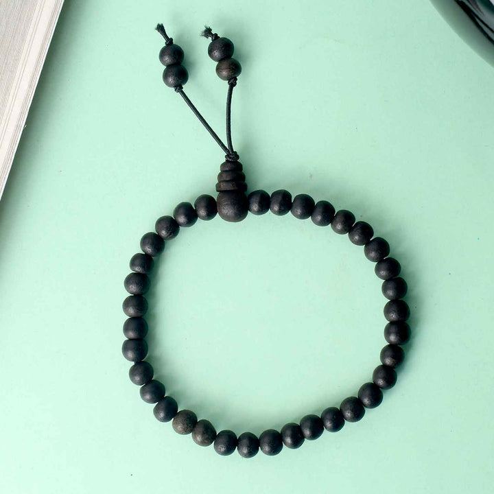 8mm Ebony Bracelet with Gloss Finish – polished black wooden beads with a shiny surface, designed for a refined and spiritual appearance. India’s Largest Pooja Accessories Brand - www.satvikworld.com
