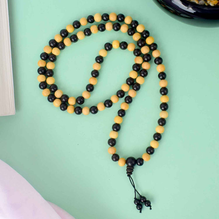 8mm Ebony & White Scented Mala – 108+1 bead meditation mala combining dark ebony and fragrant white sandalwood beads for spiritual balance and focus. India’s Largest Pooja Accessories Brand - www.satvikworld.com
