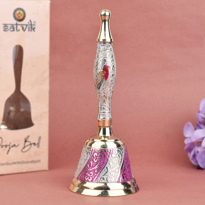 Elegant handcrafted brass puja bell with white and pink enamel finish, designed for daily temple rituals and festive prayers. India’s Largest Pooja Accessories Brand – www.satvikworld.com