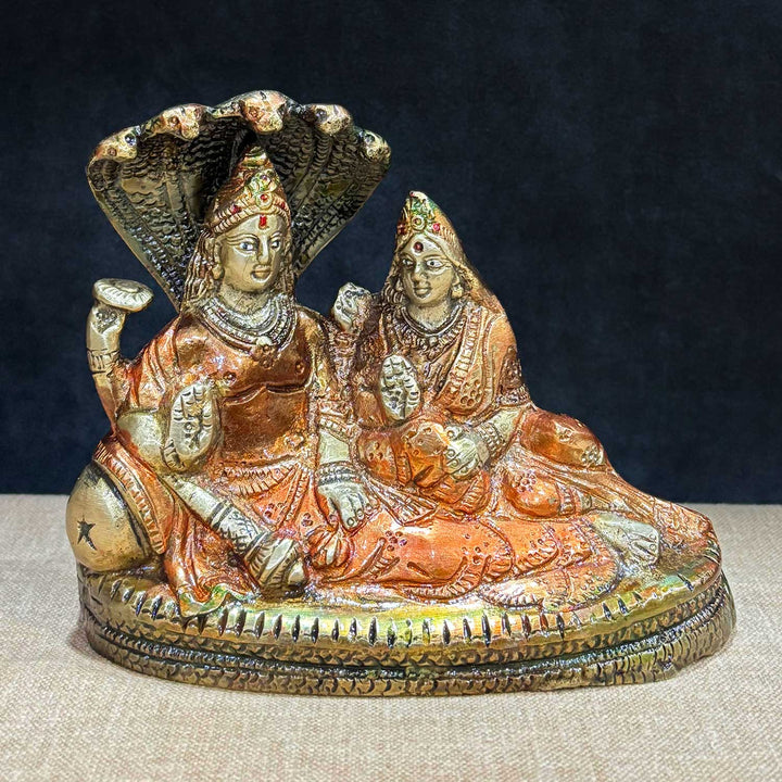 4.7 Inch Vishnu Ji Resting on Sheshnag with Parvati – Small Divine Brass Statue of Lord Vishnu Reclining on Sheshnag with Goddess Parvati, Symbolizing Cosmic Protection, Peace, and Divine Harmony, Perfect for Temple, Home Decor, and Spiritual Worship, Handcrafted with Intricate Detailing for a Sacred Touch, Ideal for Puja and Mandir Decoration, Buy Vishnu and Parvati Statue Online, Affordable God Statue Prices | India’s Largest Pooja Accessories Brand – www.satvikworld.com