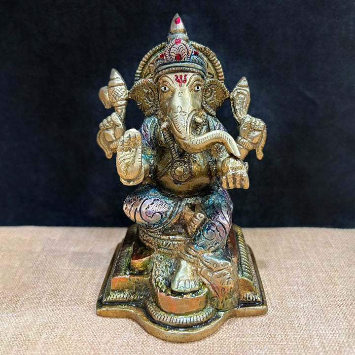 5.1 Inch brass Ganesh idol symbolizing wisdom and prosperity, intricately carved and seated in a calm, traditional posture with detailed ornaments. Ideal for home temple or gifting. India’s Largest Pooja Accessories Brand – www.satvikworld.com