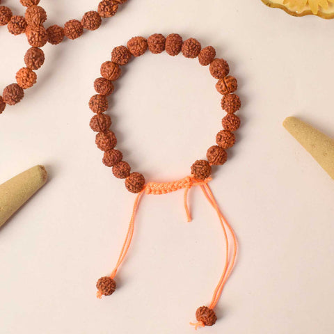 Handcrafted dark brown Rudraksha bracelet made with sacred beads for spiritual balance and meditation. India’s Premium Rudraksha Jap Mala Store- www.satvikworld.com