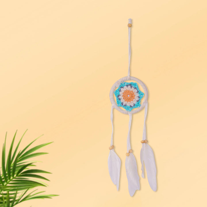 Handcrafted round-shaped dream catcher wall hanging with soft feather charms, ideal for bedroom or meditation space decor. India’s Largest Pooja Accessories Brand – www.satvikworld.com