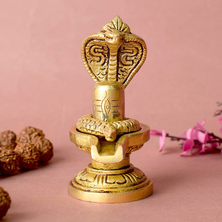 Elegant Brass Shivling with coiled Nag, symbolizing spiritual energy and protection, perfect for home worship and meditation. India’s Largest Pooja Accessories Brand – www.satvikworld.com