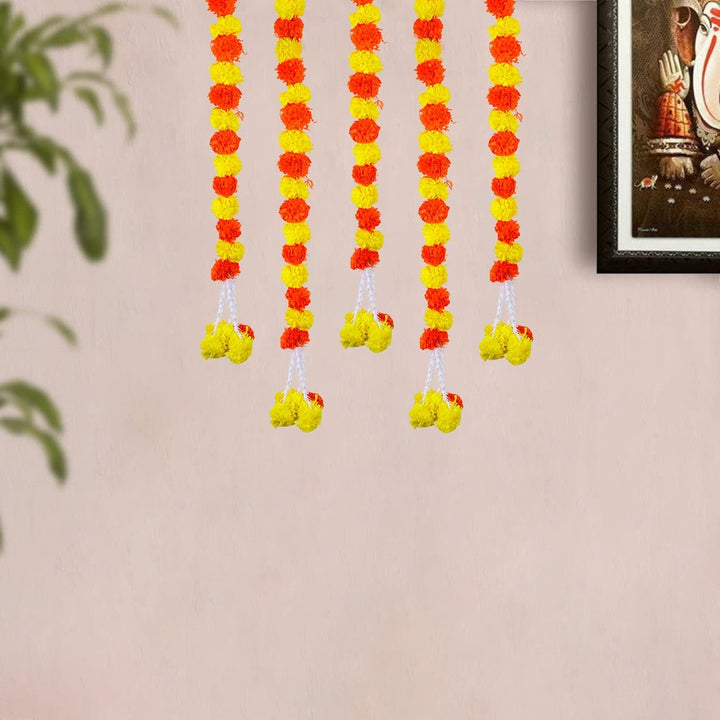 Beautiful Red and Yellow Backdrop Latkan with vibrant red and yellow fabric and decorative hanging elements for festive and wedding decoration. India’s Largest Pooja Accessories Brand – www.satvikworld.com