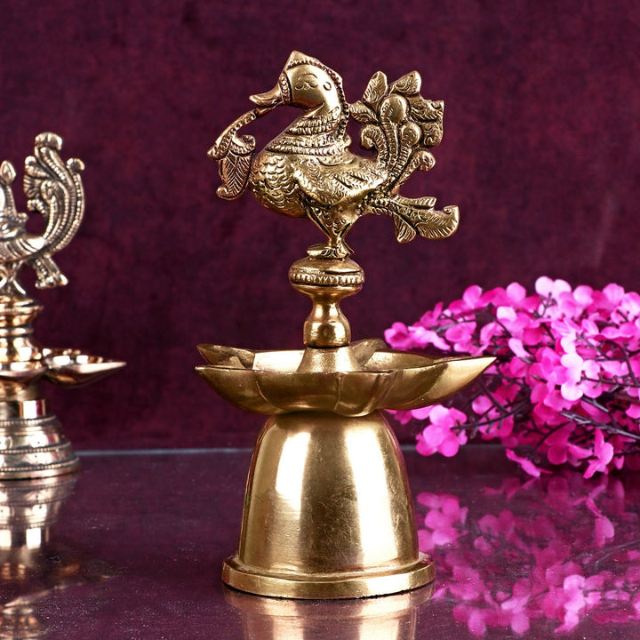 Elegant Peacock Brass Diya with a beautifully crafted peacock design, perfect for festive occasions and spiritual rituals. India’s Largest Pooja Accessories Brand – www.satvikworld.com