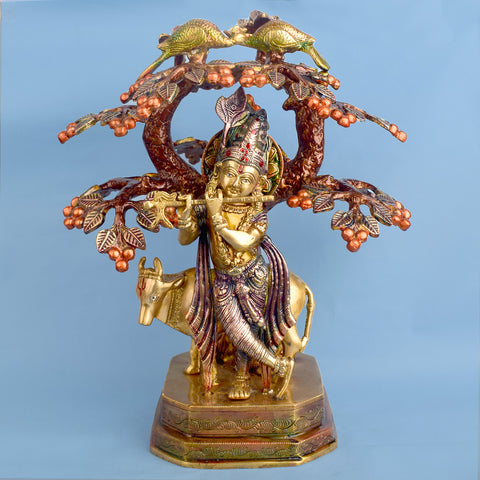 13.4-inch pure brass statue of Lord Krishna standing with a cow under a tree, representing divine love, protection, and harmony, perfect for home or temple decor. India’s Largest Brass Idols Brand - www.satvikworld.com
