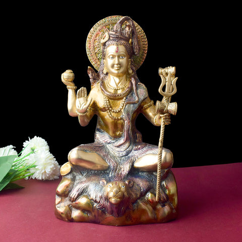 13.5 Inch Elegant Lord Shiva Sculpture – A stunning brass sculpture of Lord Shiva in a graceful pose, symbolizing power and tranquility. Perfect for temple altars, spiritual home decor, and worship spaces. India’s Largest Pooja Accessories Brand – www.satvikworld.com