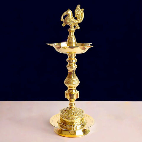 13 inch brass 1 step embossed peacock Kerala stand diya, traditional Kerala Nilavilakku for pooja, temple rituals, and festive décor. India’s Largest Pooja Accessories Brand – www.satvikworld.com