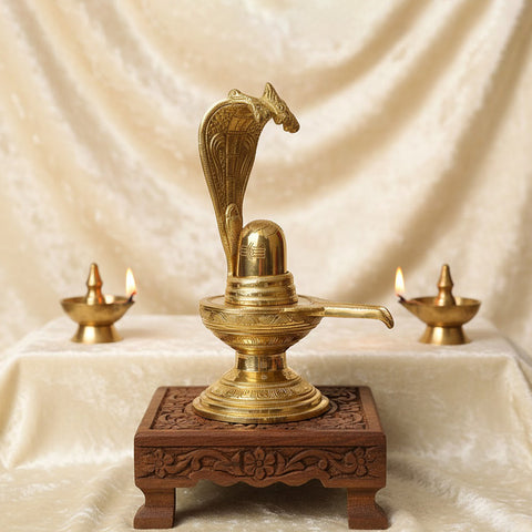 14.2 Inch Brass Shiva Ling with Nag Hood – A divine, intricately designed statue of Lord Shiva’s sacred Lingam with a Nag Hood. Perfect for Shivratri celebrations, worship, and enhancing your spiritual space. India’s Largest Pooja Accessories Brand – www.satvikworld.com