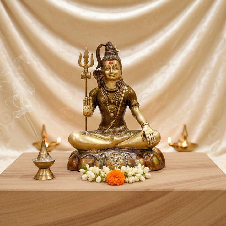 A 17-inch handcrafted Brass Shiva Idol in a meditative posture, radiating peace and tranquility, perfect for enhancing the spiritual atmosphere of your home or temple. Ideal for meditation spaces and devotion. India’s Largest Pooja Accessories Brand – www.satvikworld.com