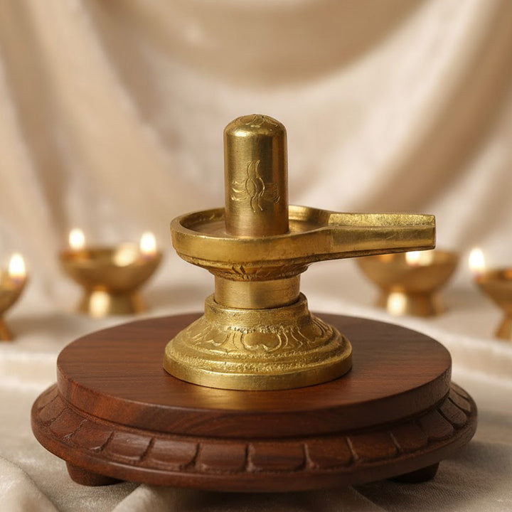 2.6-inch elegant brass Shivlingam, beautifully crafted with intricate detailing, symbolizing Lord Shiva's divine presence and energy. Perfect for worship or spiritual décor. India’s Largest Pooja Accessories Brand – www.satvikworld.com