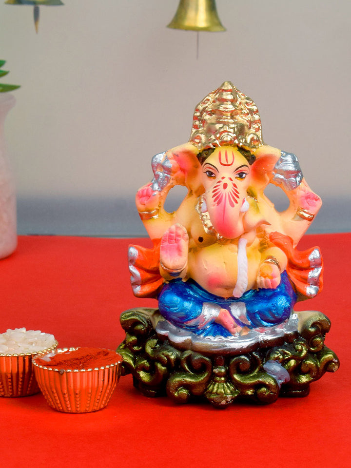 4-inch colorful eco-friendly Ganesha idol with golden mukut, made of natural clay and hand-painted in vibrant hues, ideal for home puja and visarjan. India’s Largest Pooja Accessories Brand – www.satvikworld.com
