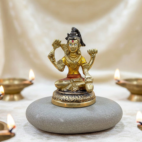 4-inch brass Chaturbhuj Shiva Ji idol, depicting Lord Shiva with four arms, intricately detailed with divine symbols, symbolizing power, protection, and spiritual balance. Ideal for worship or spiritual décor. India’s Largest Pooja Accessories Brand – www.satvikworld.com