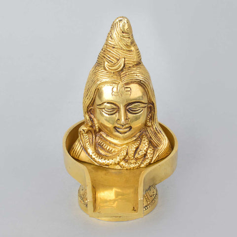 5.2-inch brass Lord Shiva Mukhalingam Shivling, beautifully crafted to represent the divine presence of Lord Shiva, symbolizing purity, transformation, and spiritual power. Ideal for pooja rooms, worship, or spiritual décor. India’s Largest Pooja Accessories Brand – www.satvikworld.com