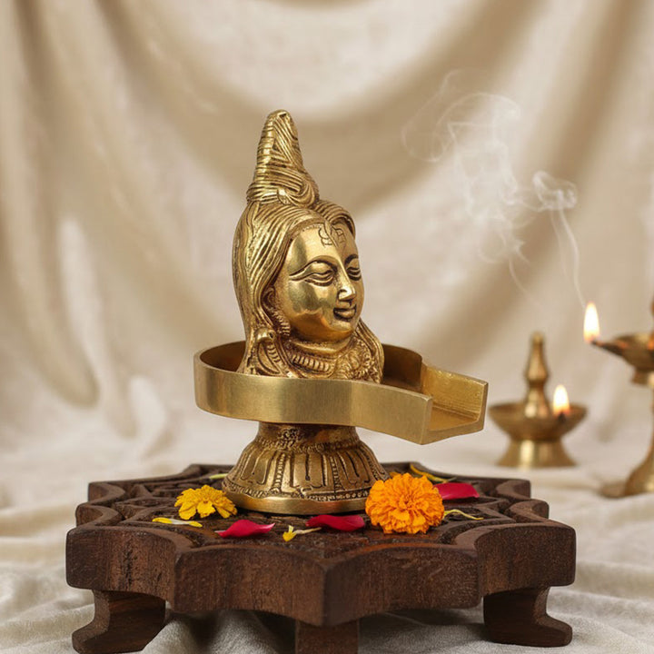 5.2-inch brass Lord Shiva Mukhalingam Shivling, beautifully crafted to represent the divine presence of Lord Shiva, symbolizing purity, transformation, and spiritual power. Ideal for pooja rooms, worship, or spiritual décor. India’s Largest Pooja Accessories Brand – www.satvikworld.com