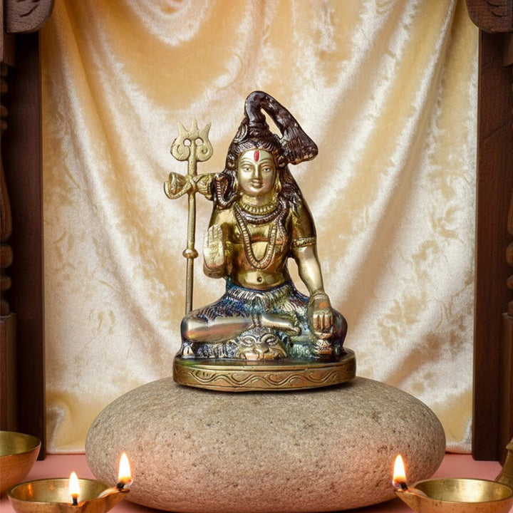 6-inch handcrafted brass Shiv idol, with Lord Shiva seated in a cross-legged posture and a trishul beside him. A finely crafted piece perfect for pooja rooms or spiritual spaces. India’s Largest Pooja Accessories Brand – www.satvikworld.com
