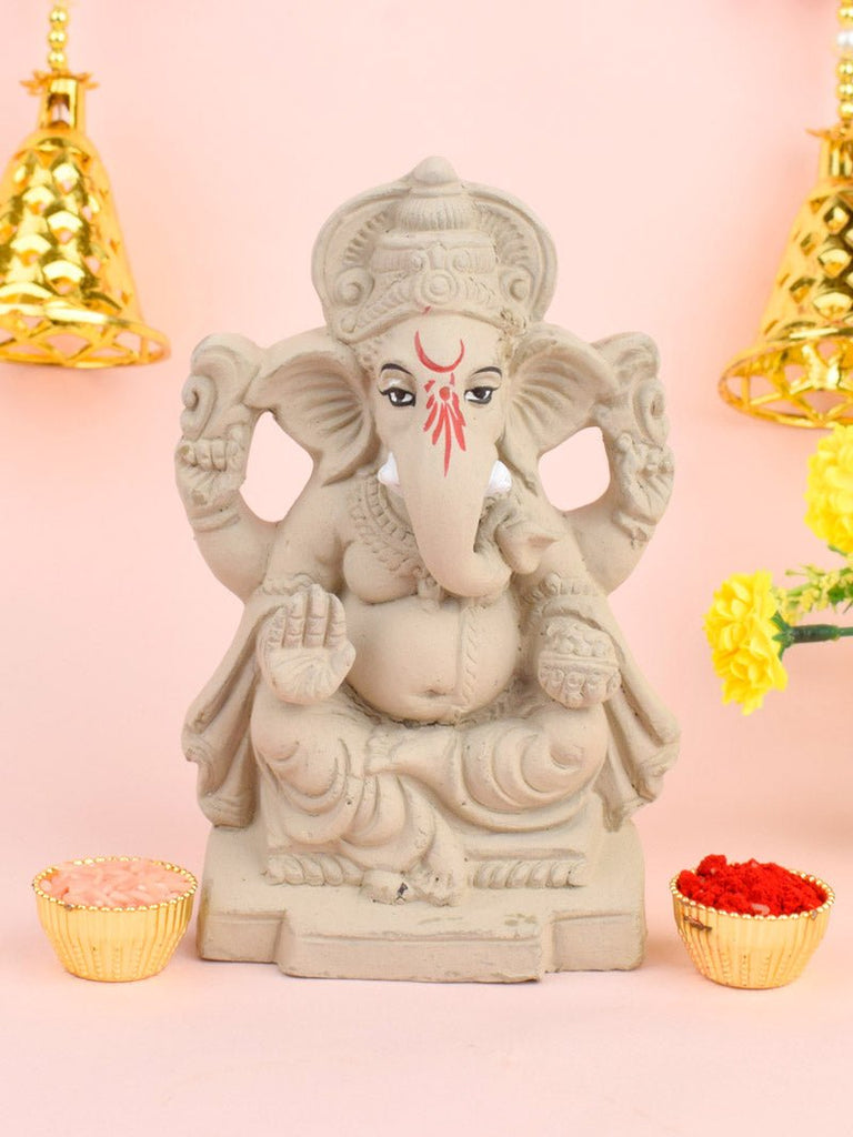 6 Inch eco-friendly Ganesha idol seated gracefully with one leg folded, featuring intricate detailing and a peaceful expression. India’s Largest Pooja Accessories Brand – www.satvikworld.com 
