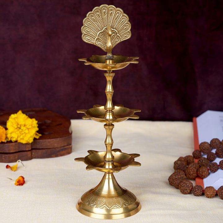 8.3 inch brass flying peacock 3 step Kerala Samai diya for pooja and temple use. India’s Largest Pooja Accessories Brand – www.satvikworld.com
