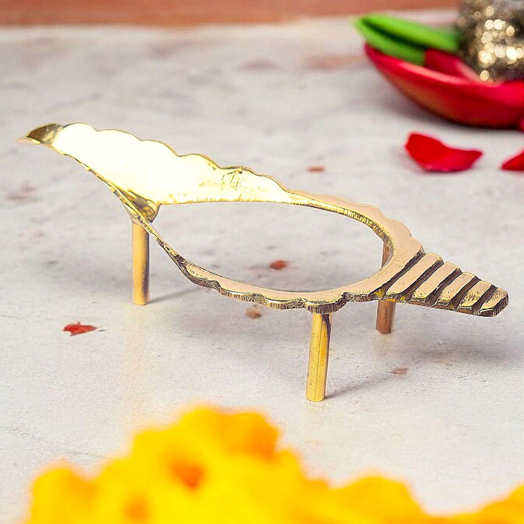 8 inch beautifully crafted brass Shankh (conch) stand with detailed traditional motifs, ideal for showcasing conch shells in puja rooms and sacred spaces. India’s Largest Pooja Accessories Brand – www.satvikworld.com