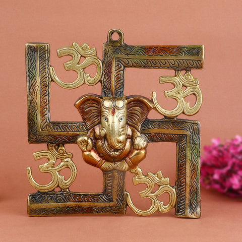 Alluring pure brass Om Swastik Ganesh wall hanging, beautifully designed with sacred symbols of Om, Swastik, and Lord Ganesha to bring positivity, protection, and prosperity. Ideal for entrances, pooja rooms, or gifting. India’s Largest Pooja Accessories Brand – www.satvikworld.com