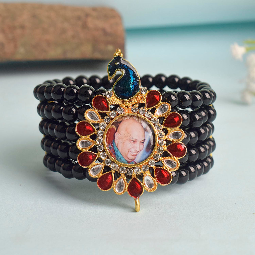 Black Beads Five Layer Guruji Swaroop Bracelet featuring a regal peacock-shaped pendant with Jai Guruji Swaroop – perfect for spiritual wear, meditation, and gifting. India’s Largest Pooja Accessories Brand – www.satvikworld.com