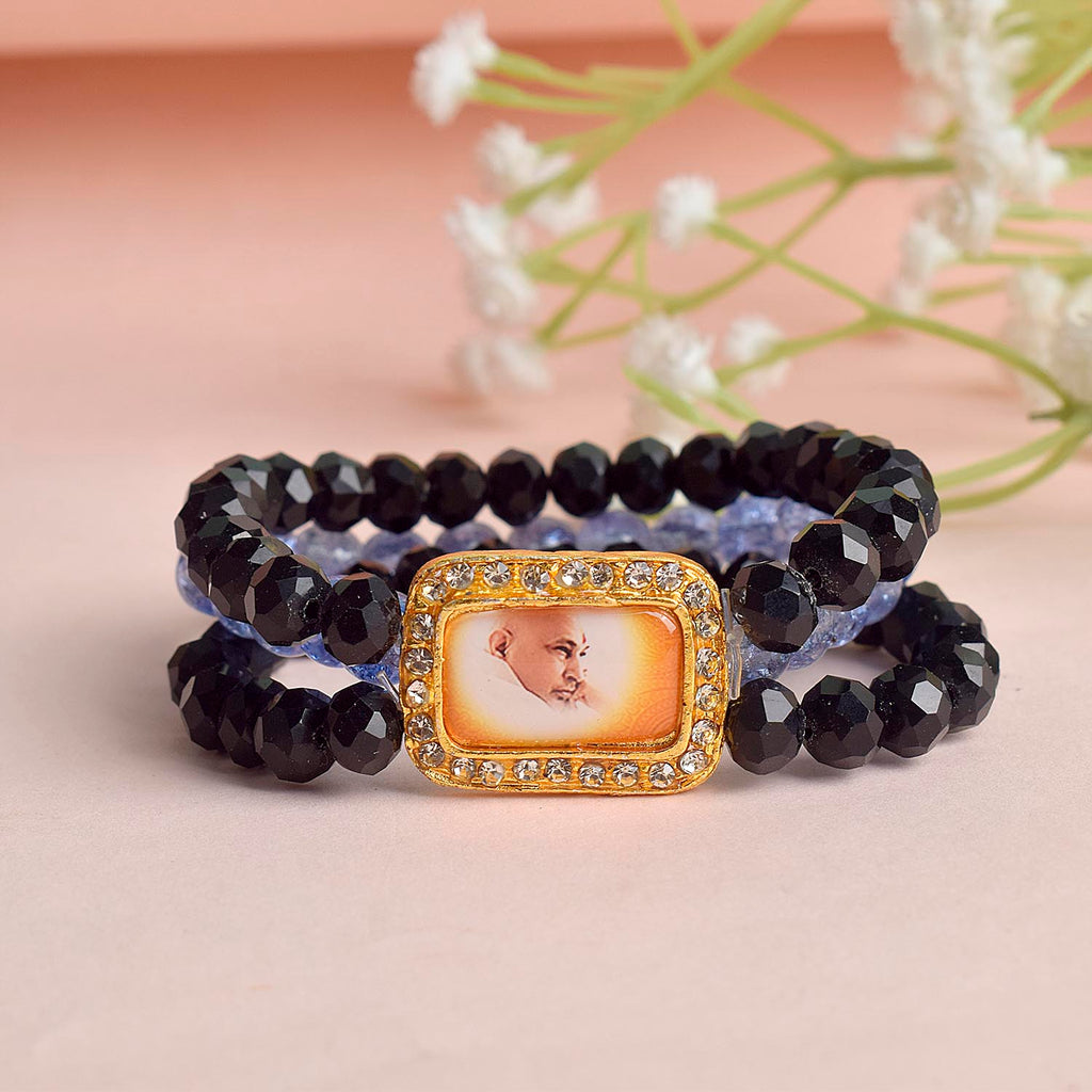 Black & Purplish Blue Triple Layer Guruji Swaroop Bracelet featuring sleek black beads with vibrant purplish blue middle layer and Jai Guruji Swaroop – perfect for spiritual wear, meditation, and gifting. India’s Largest Pooja Accessories Brand – www.satvikworld.com
