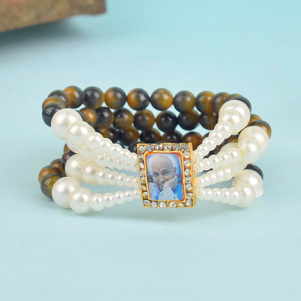 Black & Yellow with White Pearl Four Layer Guruji Swaroop Bracelet featuring striking black and yellow beads accented with luminous white pearls and Jai Guruji Swaroop – perfect for spiritual wear, festive gifting, and daily devotion. India’s Largest Pooja Accessories Brand – www.satvikworld.com