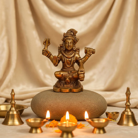 Brass Chaturbhuj Shiva Ji idol, depicting Lord Shiva with four arms, intricately crafted with divine details, symbolizing power, protection, and spiritual transcendence. Ideal for worship or spiritual décor. India’s Largest Pooja Accessories Brand – www.satvikworld.com