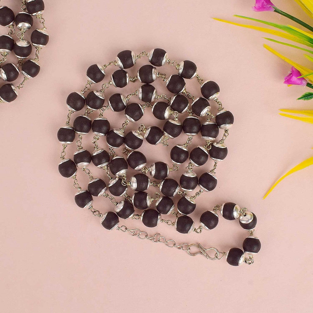 Karungli/Ebony Mala handcrafted from sacred ebony wood beads, available in two elegant variants—metal cap for daily wear and pure silver cap for premium spiritual practices, offering protection, grounding, and spiritual focus. India’s Largest Pooja Accessories Brand - www.satvikworld.com