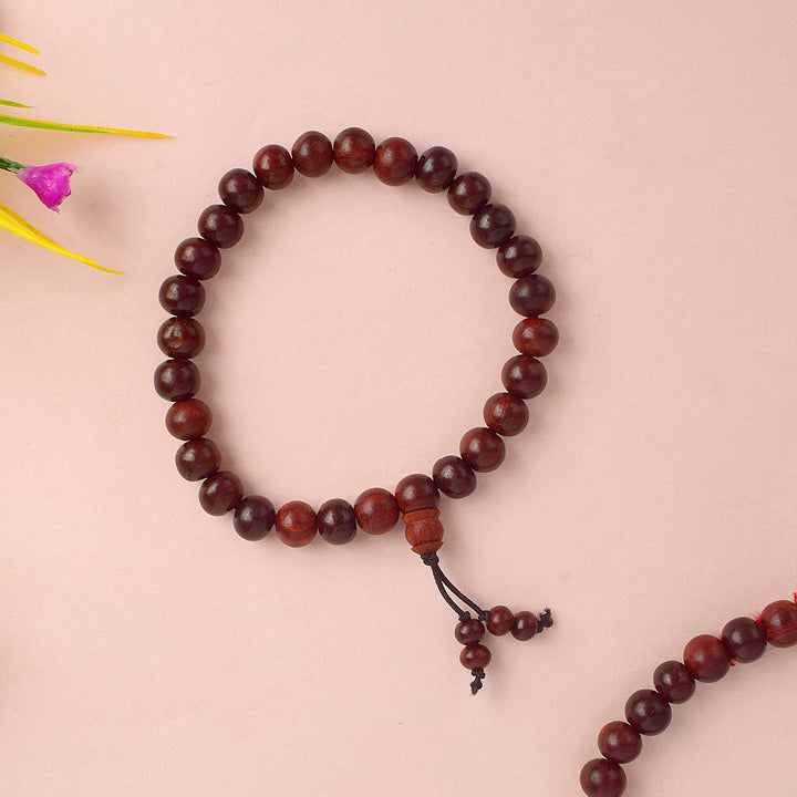 Beautiful handcrafted Red Chandan Bracelet made from pure red sandalwood beads, designed for enhancing spiritual balance, inner strength, and daily protection during meditation and pooja. India’s Largest Pooja Accessories Brand - www.satvikworld.com
