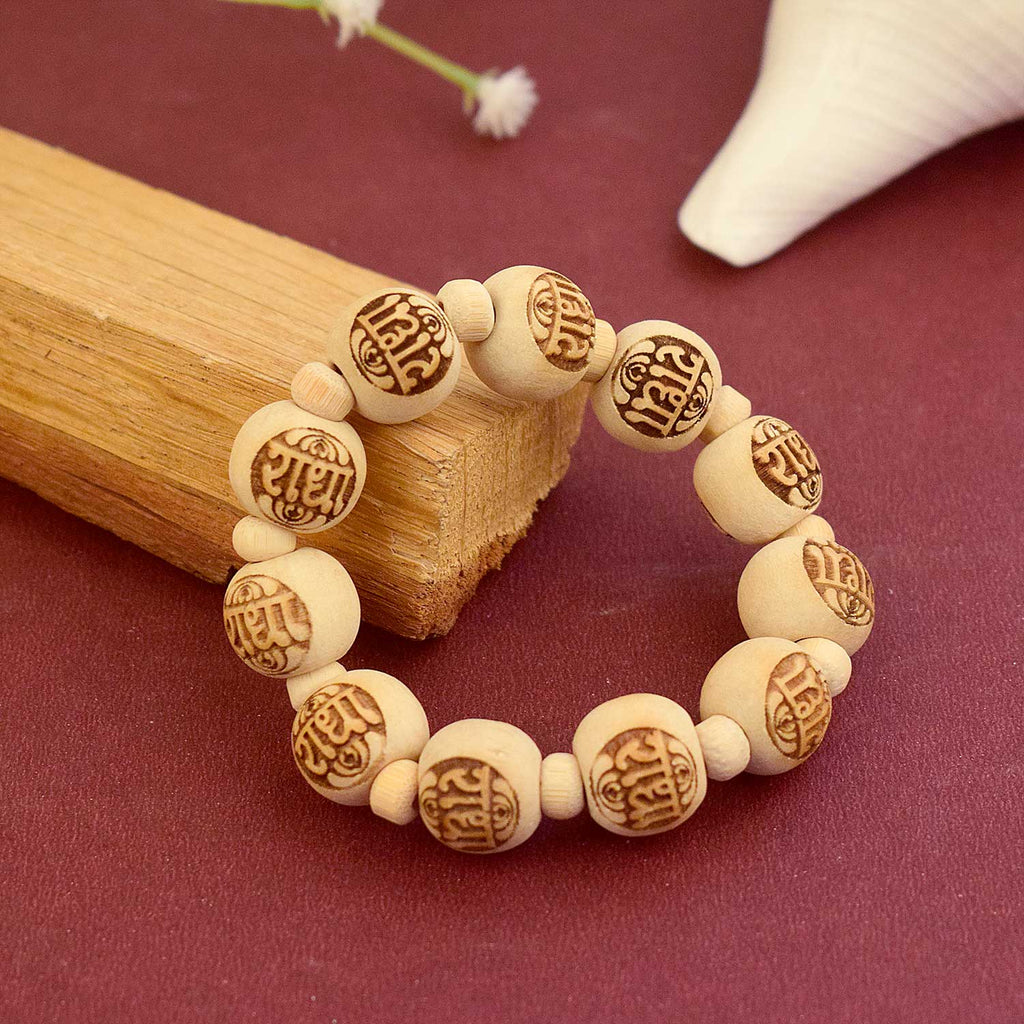 Wooden Radha Name Bracelet with natural beads and engraved Radha plate – perfect for spiritual devotion and daily bhakti wear. India’s Largest Brass Idols Brand - www.satvikworld.com
