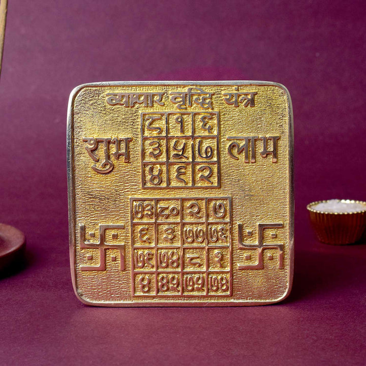 Energized Brass Vyapar Yantra for business success, engraved with divine symbols to attract financial prosperity, growth, and protection in commercial ventures. India’s Largest Pooja Accessories Brand - www.satvikworld.com
