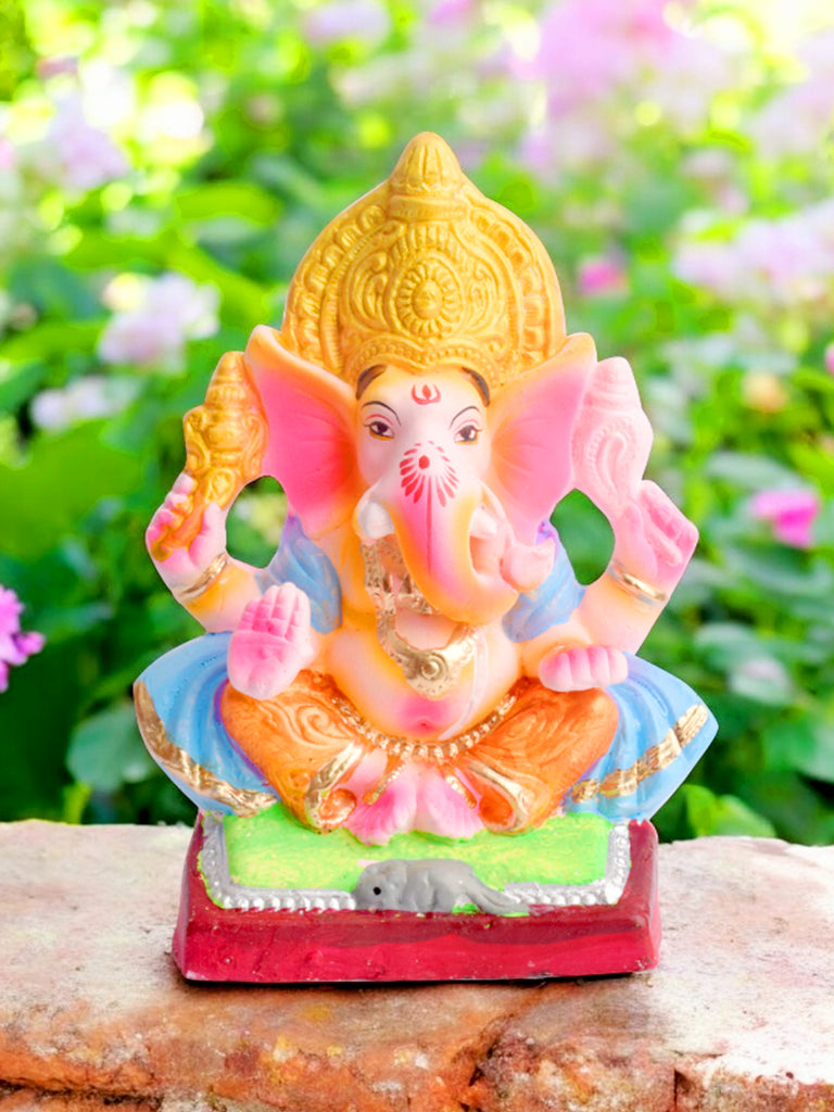 Eco-friendly 8-inch Ganesha idol in Gajanan pose wearing a sky blue patka, handcrafted using natural clay for an eco-conscious celebration. India’s Largest Pooja Accessories Brand – www.satvikworld.com