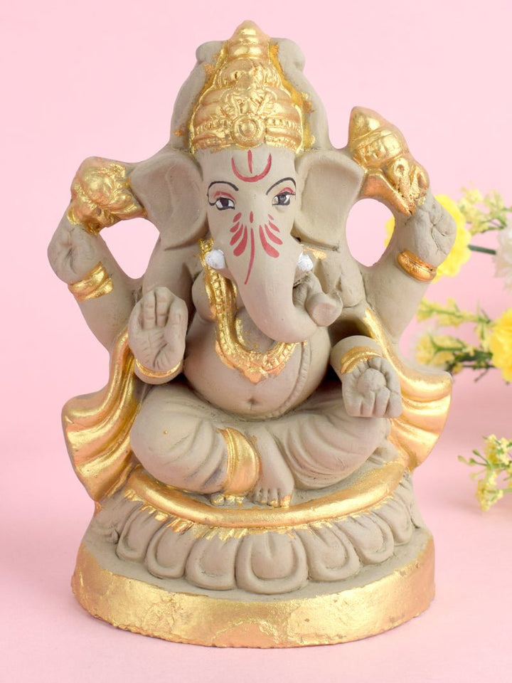 6.3 Inch Kamal Ganesha Eco-Friendly Idol adorned with intricate gold detailing, seated gracefully on a lotus base, made from natural clay. India’s Largest Pooja Accessories Brand – www.satvikworld.com