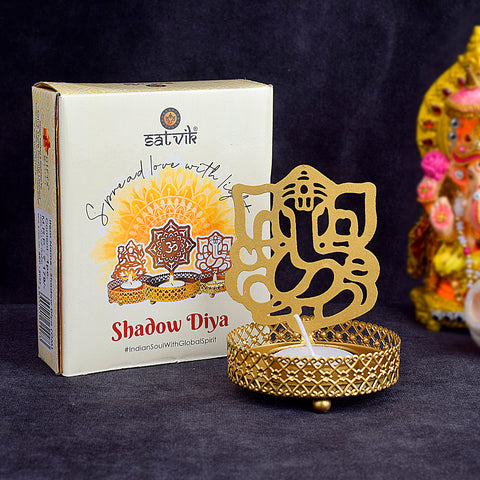 Decorative alluring OM Shadow Diya crafted from premium metal, featuring intricate OM design that creates a captivating shadow, perfect for pooja, festivals, and spiritual settings. India’s Largest Pooja Accessories Brand – www.satvikworld.com
