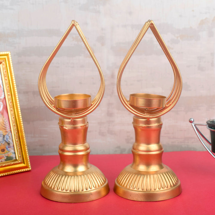Pair of luminous tealight holders with intricate cutwork design, perfect for festive, romantic, or ambient home lighting décor. India’s Largest Pooja Accessories Brand – www.satvikworld.com