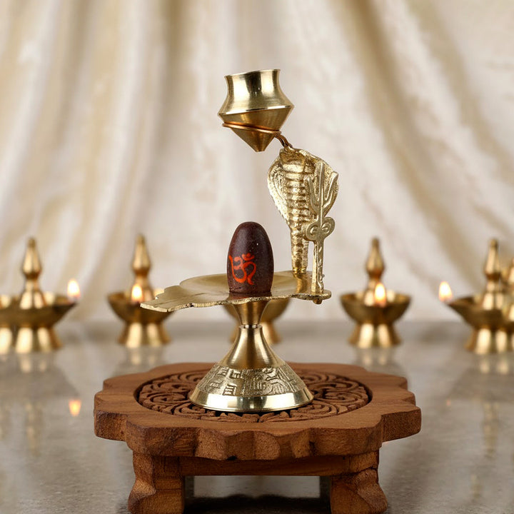 Small pure brass Narmadeshwar Shivling with sacred yoni base, ideal for pooja and divine blessings. India’s Largest Pooja Accessories Brand – www.satvikworld.com