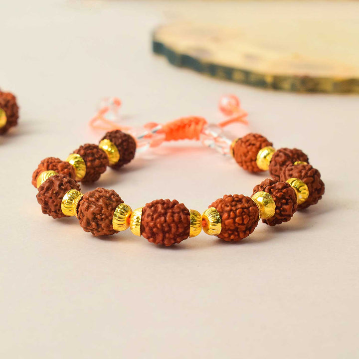 Certified dark brown rudraksha bracelet with golden brass capping for spiritual healing and protection. India’s Premium Rudraksha Jap Mala Store- www.satvikworld.com
