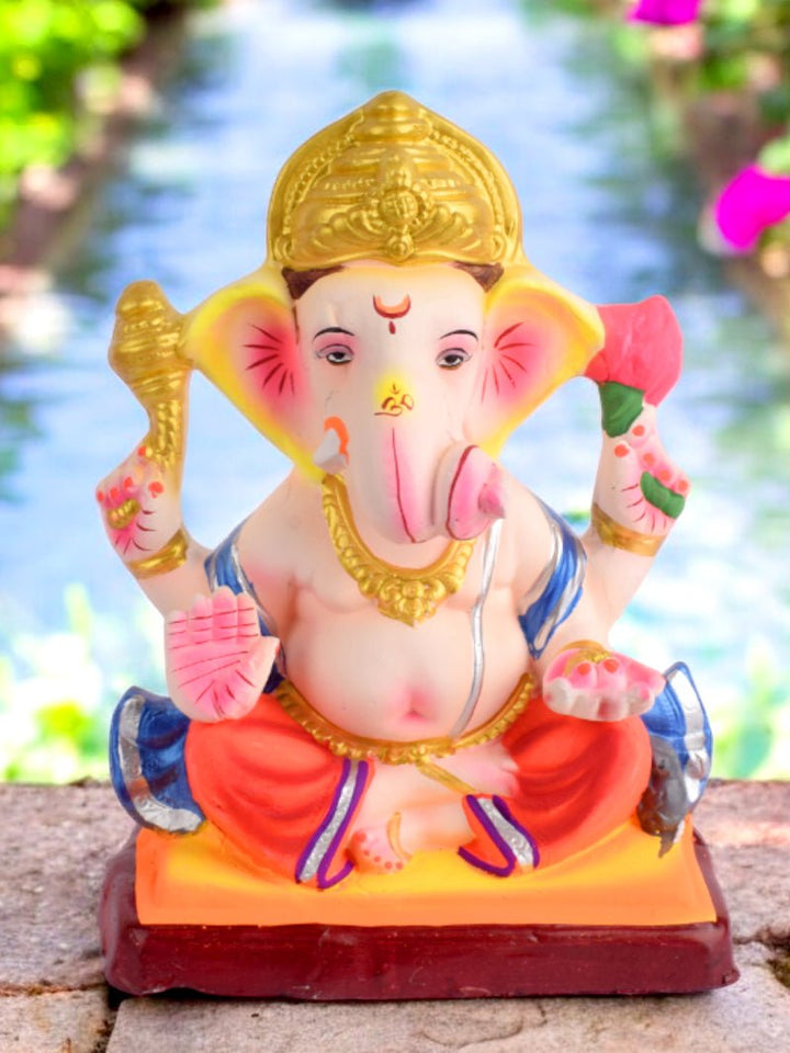 10 Inch eco-friendly Dagdusheth-style Ganesha idol made from Shadu clay, seated in majestic pose for Ganesh Chaturthi celebrations. India’s Largest Pooja Accessories Brand – www.satvikworld.com