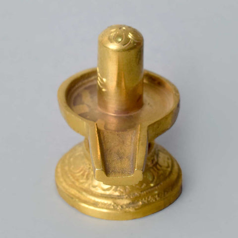 2.6-inch elegant brass Shivlingam, beautifully crafted with intricate detailing, symbolizing Lord Shiva's divine presence and energy. Perfect for worship or spiritual décor. India’s Largest Pooja Accessories Brand – www.satvikworld.com