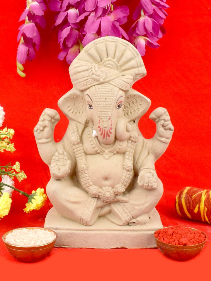 8-inch plain eco-friendly Ganesha idol adorned with traditional Pagdi and Nettipattam, handcrafted from natural clay for festive worship. India’s Largest Pooja Accessories Brand – www.satvikworld.com
