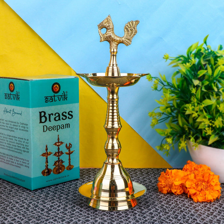 12 Inch Brass Peacock Kerala Diya – Majestic brass diya with intricate peacock design, perfect for pooja ceremonies, spiritual rituals, and home decoration. India’s Largest Pooja Accessories Brand – www.satvikstore.in