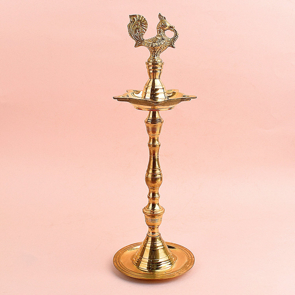 13.5 Inch Brass Peacock Kerala Diya – Elegant brass diya with detailed peacock design, ideal for pooja ceremonies, spiritual rituals, and home decor. India’s Largest Pooja Accessories Brand – www.satvikstore.in