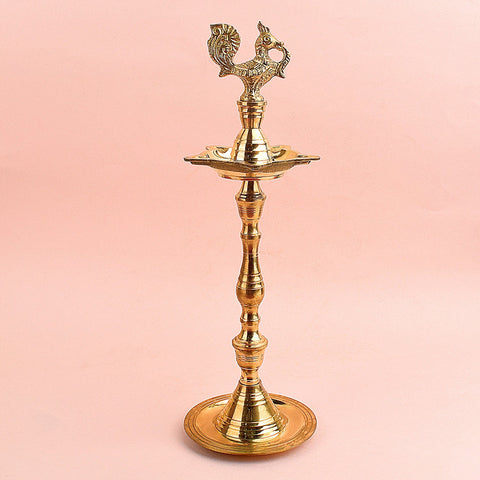 13.5 Inch Brass Peacock Kerala Diya – Elegant brass diya with detailed peacock design, ideal for pooja ceremonies, spiritual rituals, and home decor. India’s Largest Pooja Accessories Brand – www.satvikstore.in