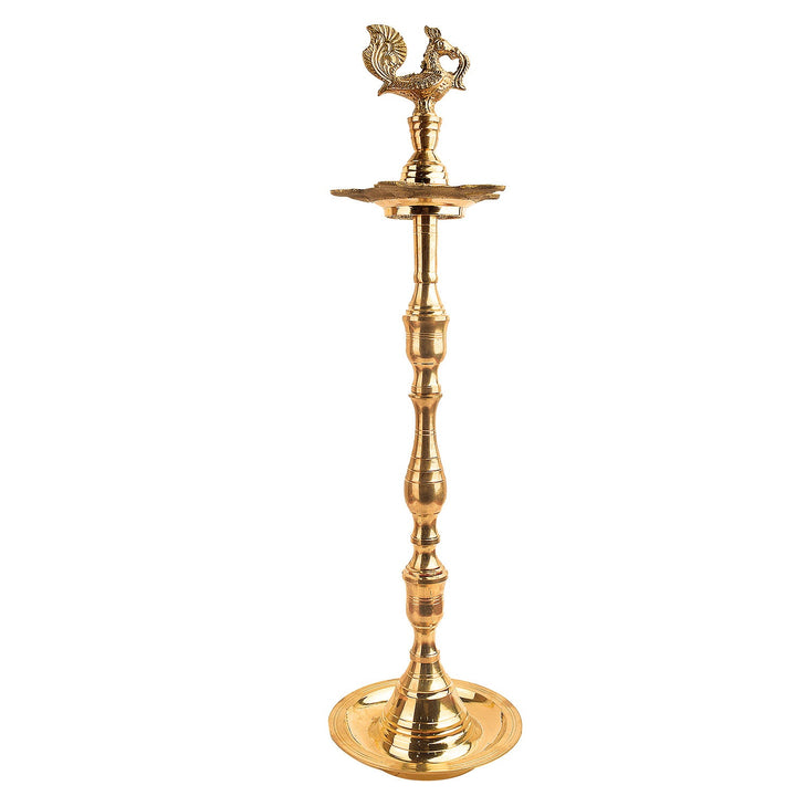 23 Inch Brass Peacock Kerala Diya – Grand brass diya with a detailed peacock motif, ideal for pooja ceremonies, spiritual rituals, and home decor. India’s Largest Pooja Accessories Brand – www.satvikstore.in