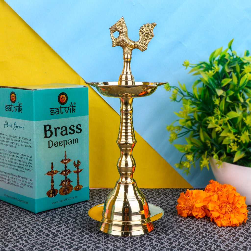 9.5 Inch Brass Peacock Kerala Diya – Elegant brass diya with intricate peacock design, ideal for pooja ceremonies, spiritual rituals, and home decoration. India’s Largest Pooja Accessories Brand – www.satvikstore.in