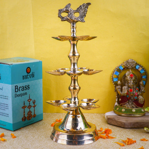 Brass 3 Step Panchmukhi Peacock Kerala Diya – Magnificent three-step brass diya with five-faced oil holders and elegant peacock detailing, ideal for traditional pooja, temple use, and festive décor. India’s Largest Pooja Accessories Brand – www.satvikstore.in