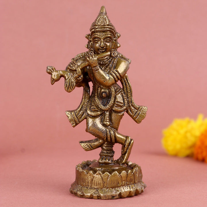 Brass Krishna idol, beautifully crafted with intricate details, depicting Lord Krishna playing the flute, symbolizing divine music, grace, and devotion. Ideal for worship or spiritual décor. India’s Largest Pooja Accessories Brand – www.satvikworld.com